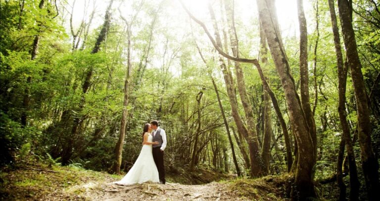 Wedding couple posing in the forest